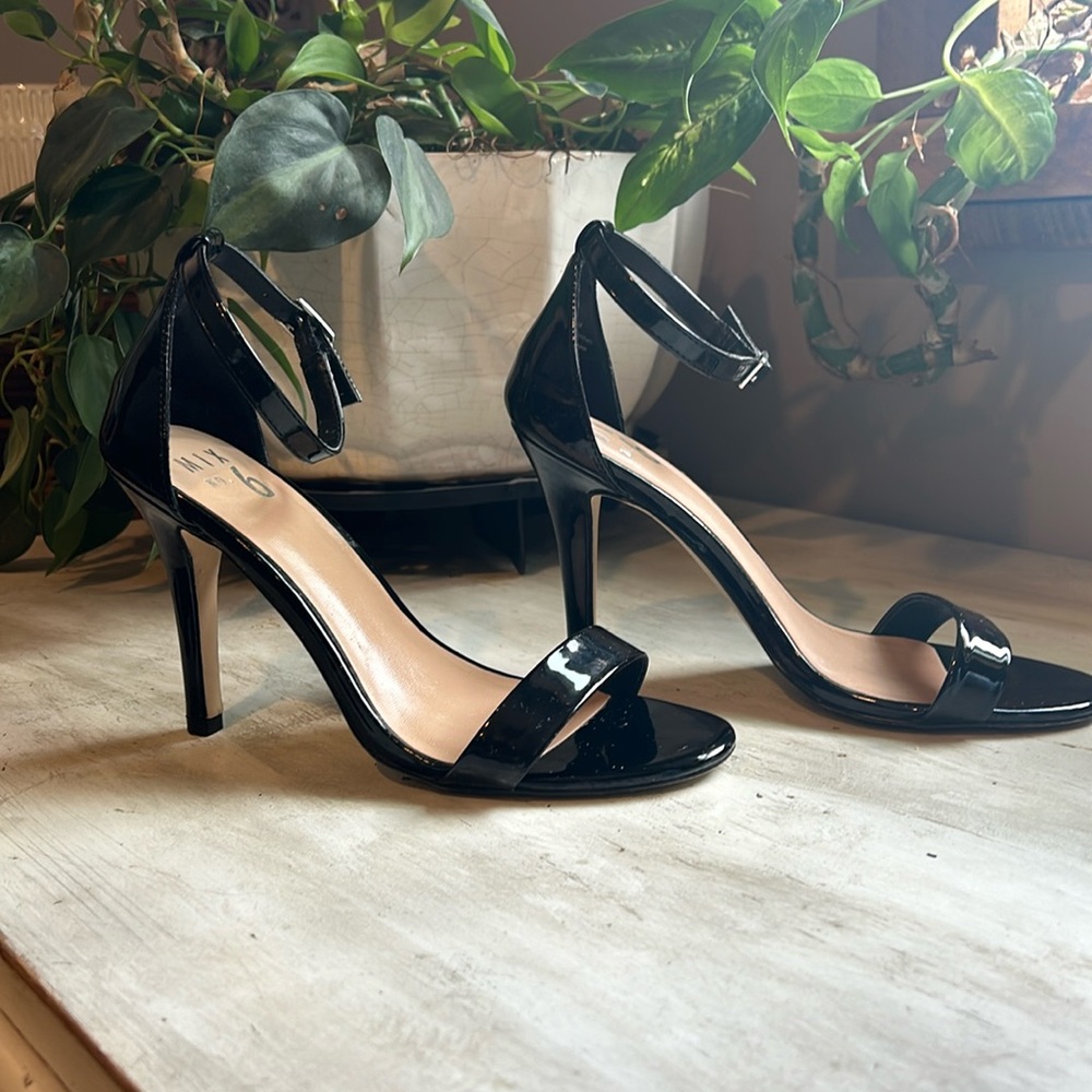 Women’s size 7.5 black strap heel.